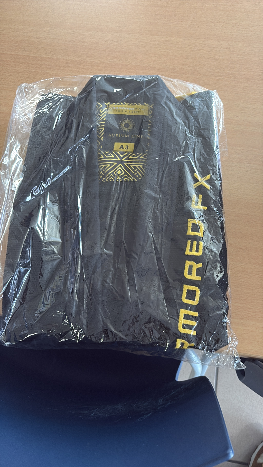 Black Aurium Line gi packaged with ARMORED FX branding.